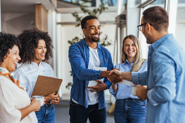 istock Diverse Team Meeting with Smiling Colleagues and Handshake 2189549626