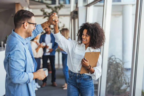 istock Diverse Team Celebrating Success With High Five in Office 2189549666
