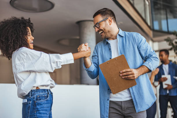 istock Happy Coworkers Celebrating Success in a Modern Office Environment 2189549727