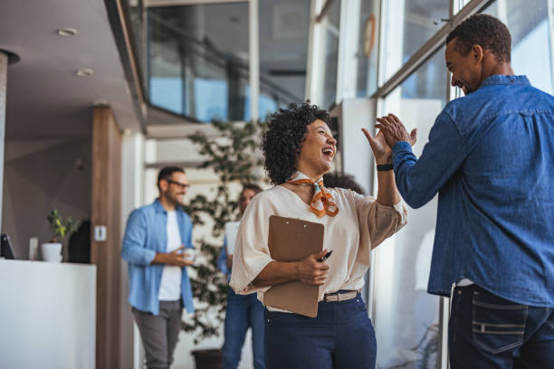 istock Colleagues Celebrating Success with a High Five in Office 2189549906