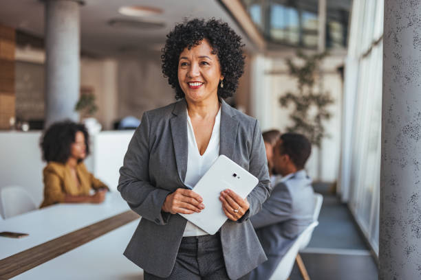 istock Confident Businesswoman Holding Tablet in Modern Office Environment 2189550776