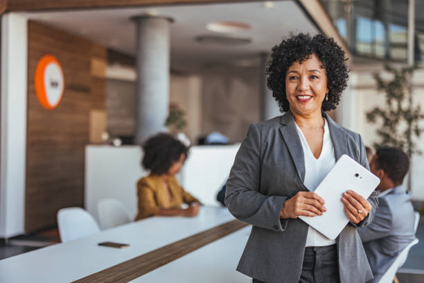 istock Confident Businesswoman Holding Tablet in Modern Office 2189550886