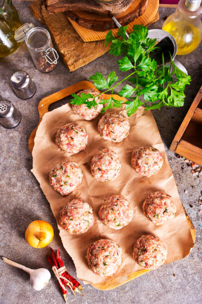 istock Raw meatball over beton ready for cooking 2189551344