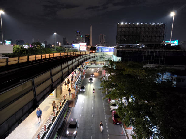Bts Skytrain riding by night at Victory monument in Ratchathewi district, Bangkok, Thailand.