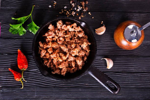 istock Pan fried minced meat to Italian pasta. Gray background. Top view. 2189553948