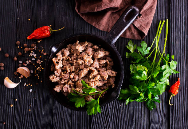 istock Pan fried minced meat to Italian pasta. Gray background. Top view. 2189553956