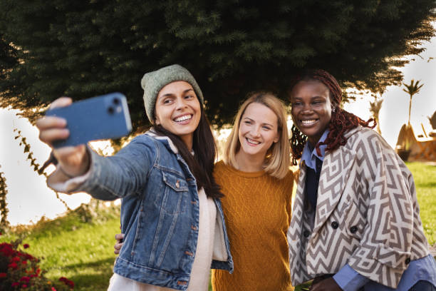 istock Three happy young women taking a selfie in the backyard 2189554921
