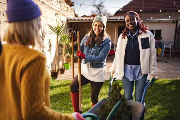 istock Three female friends gardening together in backyard 2189554959