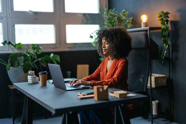 istock Young black businesswoman working from home typing on a laptop computer 2189558173