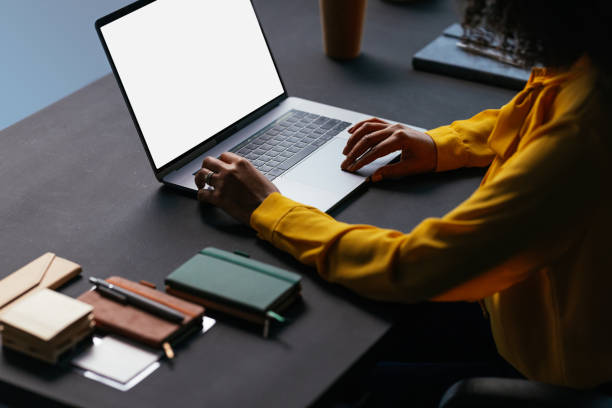 istock Freelancer working on laptop with blank screen at home office 2189558200