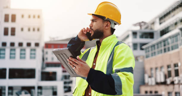 istock Phone call, engineer and tablet with man in city for architecture, building or communication. Construction site, contractor and project manager with person in outdoor for urban development update 2189559156