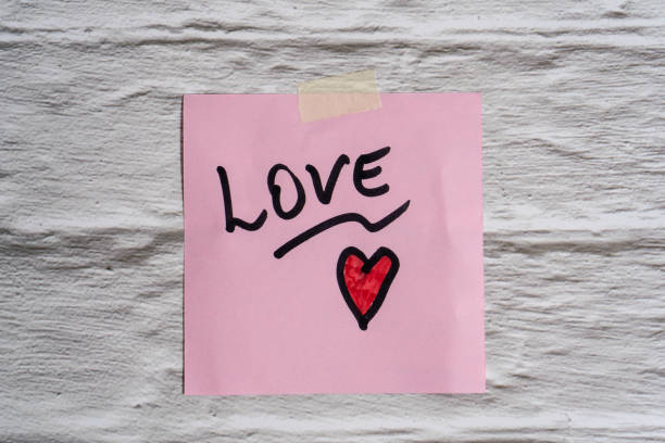 istock The word love written on a post-it or note. 2189561408