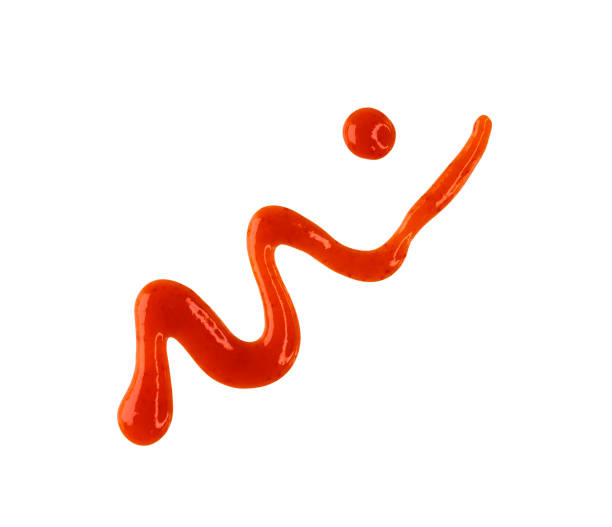 Line and drops of red hot chilli sauce isolated on white, top view, clipping path