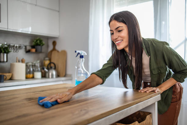 istock Cleaning in style, woman wiping down kitchen island 2189563283