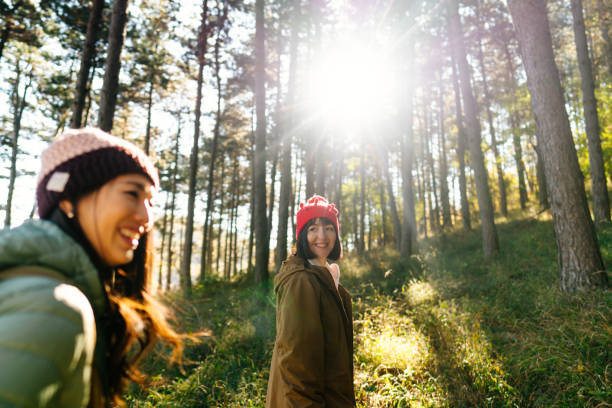 istock Female friends hiking together 2189564949