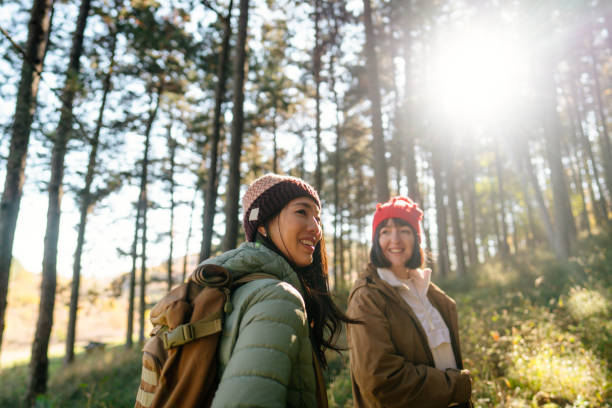 istock Female friends hiking together 2189565001