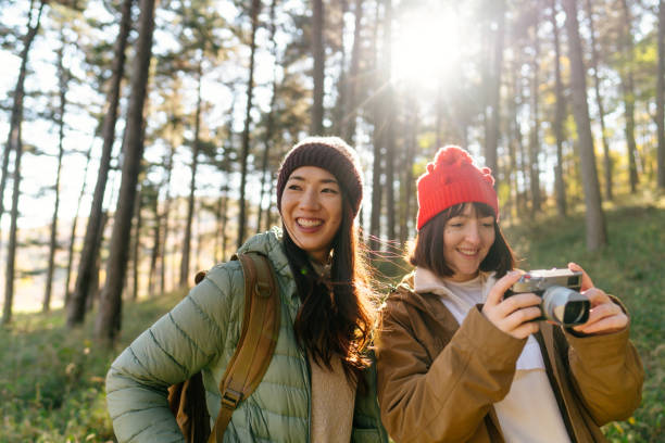 istock Female friends hiking together 2189565005