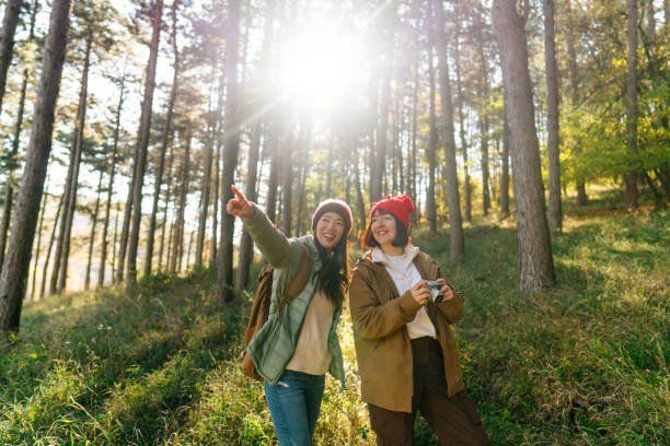 istock Female friends hiking together 2189565029