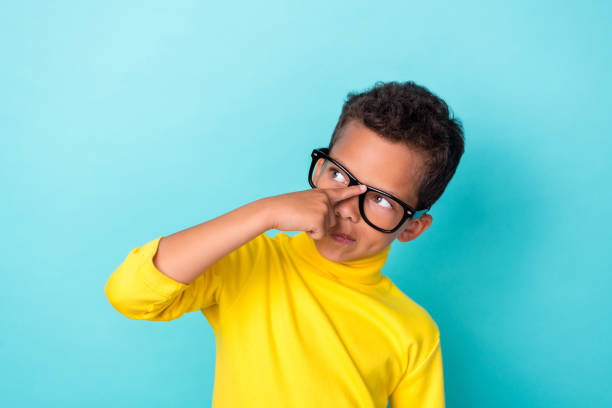 istock Photo of smart minded boy nerd arm touch eye accessory lesson hmm consider creative plan idea question isolated on cyan color background 2189566122