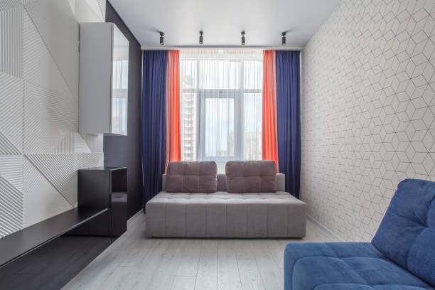 Living room with 3D Embossed Decorative Wall Panel with White and blue sofa.