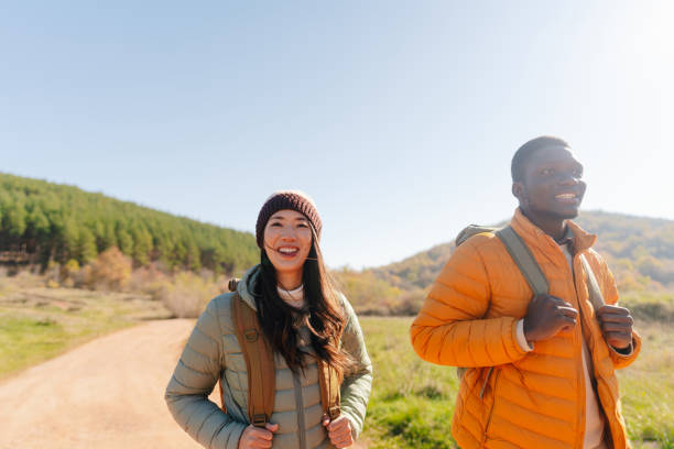 istock Smiling friends hiking together 2189567120