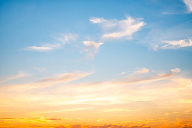 istock Sky,sunset, beautiful , luxury soft gradient orange gold clouds and sunlight on the blue sky perfect for the background, Sunrise on morning or everning in winter warm time ,Twilight summer,silhouette 2189569712