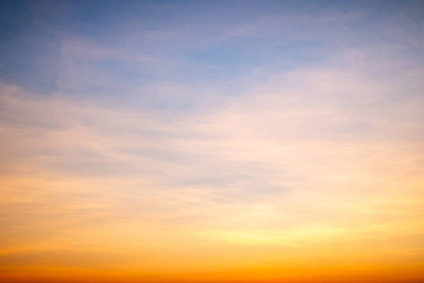istock Sky,sunset, beautiful , luxury soft gradient orange gold clouds and sunlight on the blue sky perfect for the background, Sunrise on morning or everning in winter warm time ,Twilight summer,silhouette 2189569910