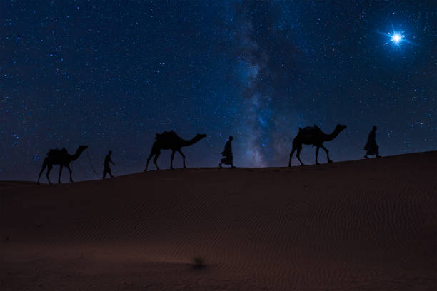 istock Three Wise Men, Three Kings follow Bethlehem star in the night 2189572182
