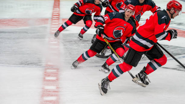 istock Professional Hockey Team Dynamic Warm-Up on Ice Rink 2189573289