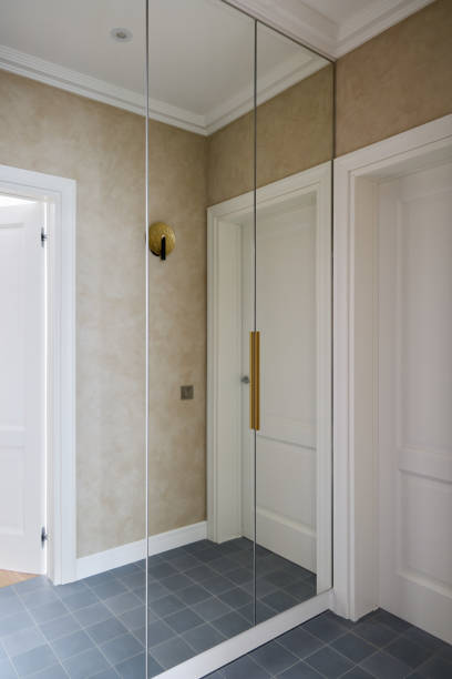 istock A Stylish Modern Hallway featuring Beautiful Mirrored Accent Walls and Elegant Lighting Solutions 2189573670