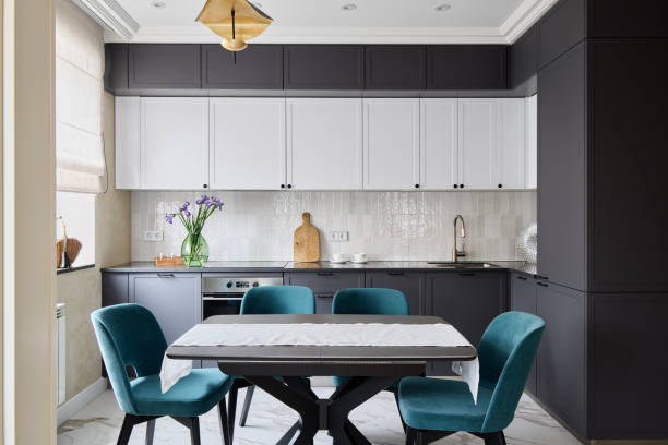 This modern kitchens elegant design and colorful accents create an inviting atmosphere