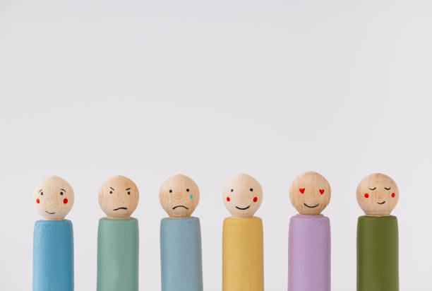 istock Image of different emotions on wooden peg dolls against white background with copy space. 2189573917