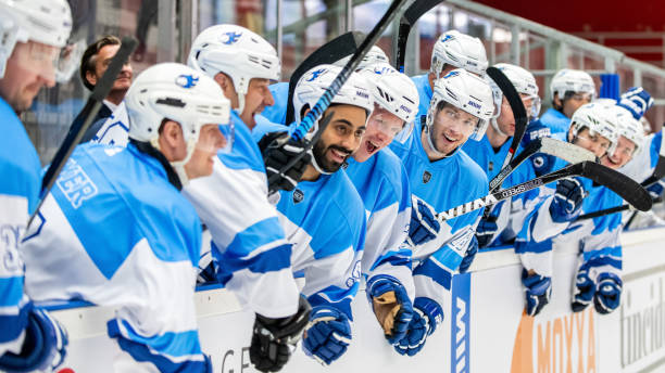 istock Enthusiastic Hockey Team by the Ice Rink 2189574439