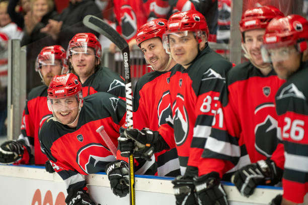 istock Smiling Hockey Team Players Alongside Ice Rink 2189574899