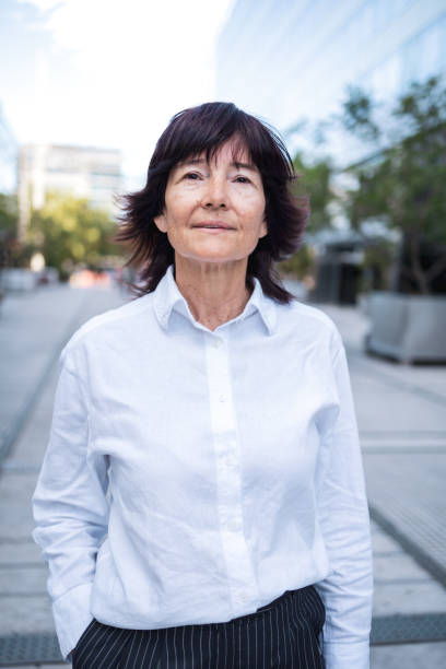istock Confident senior woman posing outdoors in an urban environment 2189579171