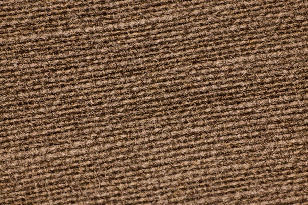 This is a detailed closeup showing a textured brown fabric, which is ideal for various design and media projects