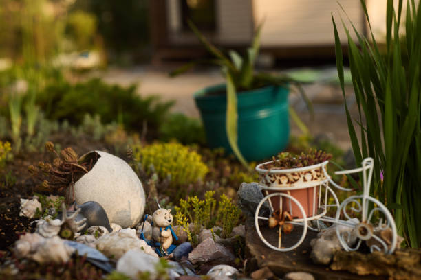 A beautifully picturesque corner of the garden showcasing a variety of decorative items amidst lush greenery