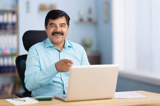 istock Businessman using laptop in office stock photo 2189581835