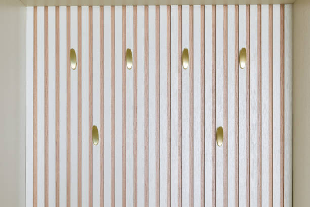 An Elegant Vertical Wall Design Featuring Beautiful Golden Accents Throughout the Space