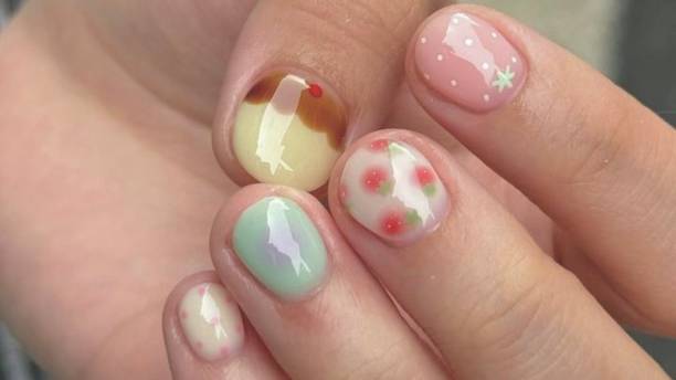 istock Creative nail art featuring intricate designs, vibrant colors, and unique patterns. Perfect for beauty and fashion photography, showcasing trends in nail designs and the artistry of manicure techniques. 2189582335
