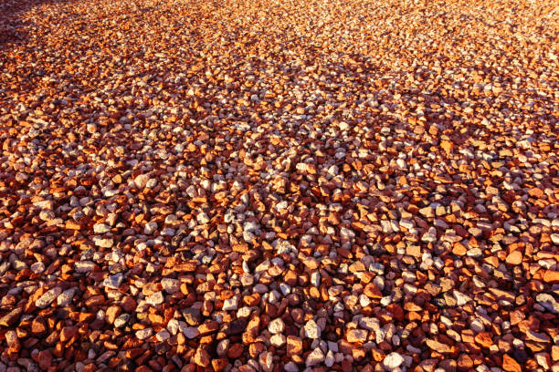 Bright red-brown gravel that often used in decorative xeriscaped grounds, background or backdrop