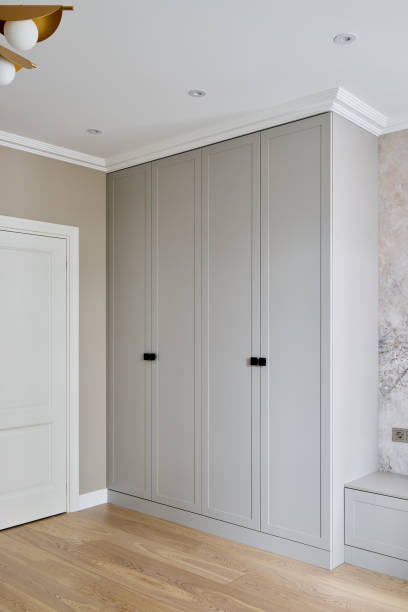 istock A Modern Bedroom Featuring a Stylish Wardrobe Accompanied by Elegant Wooden Flooring 2189583027