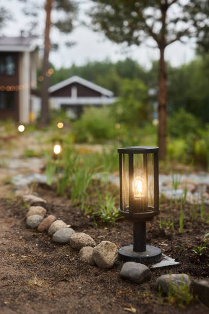 istock Elegant Outdoor Lanterns That Brightly Illuminate a Serene Garden Pathway at Night 2189585494