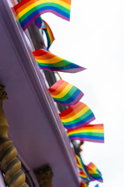 istock Pride flags are representing LGBT community and intersexual diversity. Rainbow LGBT flags flutter on the wind as streets decoration and support of equality. 2189585989