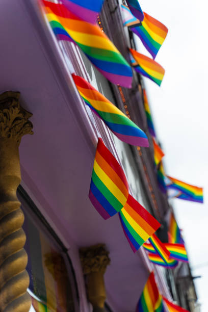 istock Rainbow flags flutter on the wind as streets decoration and support of equality. Pride flags are representing LGBT community and intersexual diversity. 2189586050