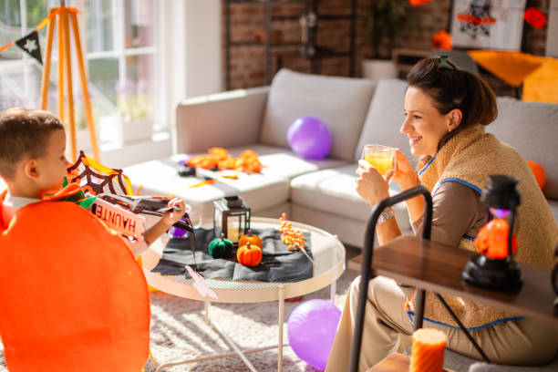 istock Family crafting Halloween decorations together in a festive home setting 2189590355