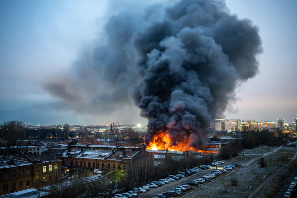 istock Heavy fire in a warehouse with toxic paint materials, fire crews are involved in extinguishing. 2189591347