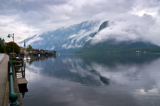 Morning mist at beautiful Hallstatt village on Hallstatter Lake in the Austrian Alps in the region of Salzkammergut, Austria.