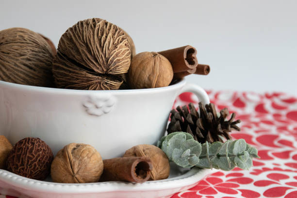 shelled walnuts in wooden spoon