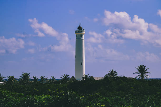 istock Lighthouse in tropical jungle with a sky full of clouds 2189598095